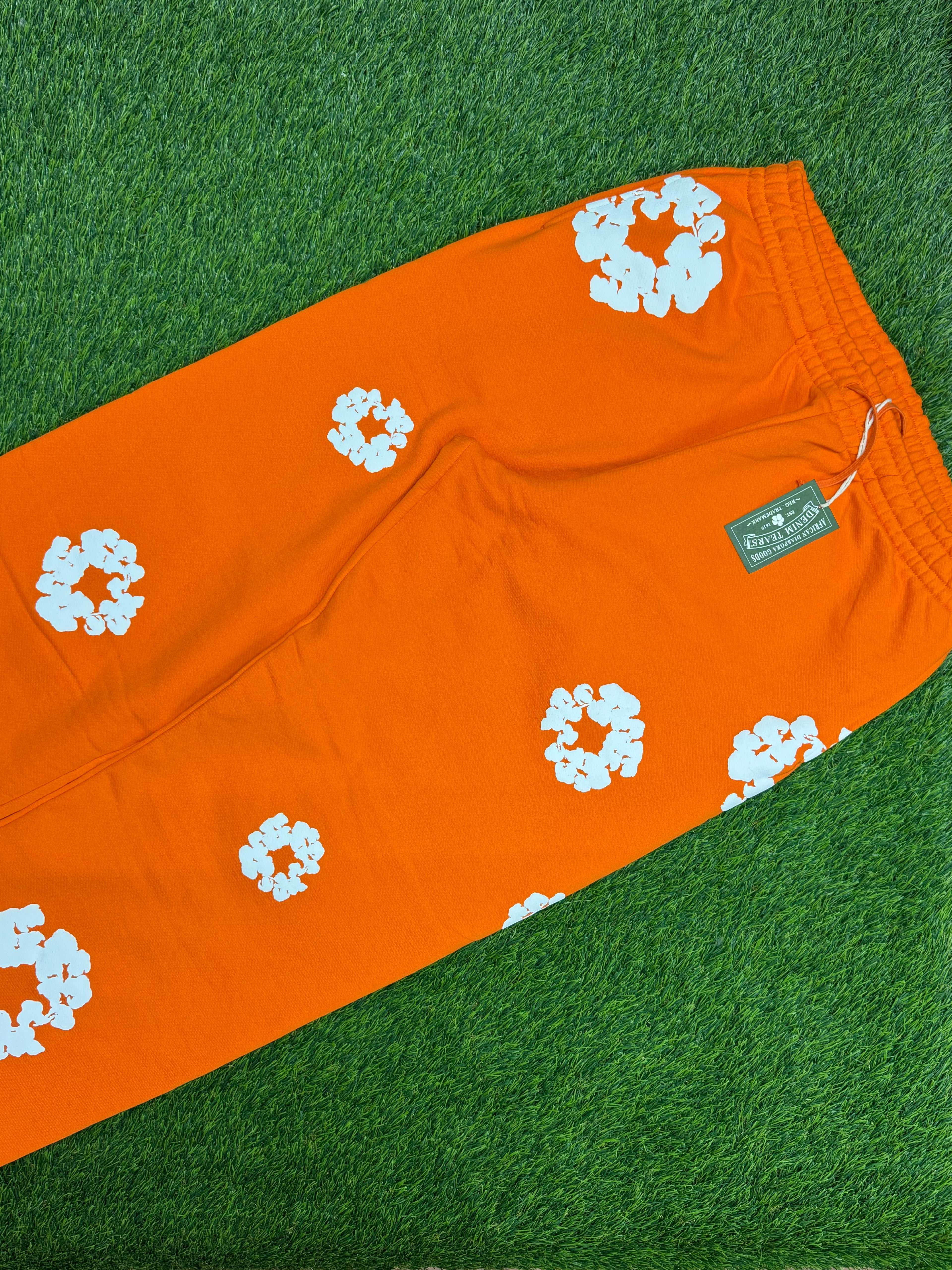 Denim Tears Cotton Wreath Baggy Sweatpants in Orange